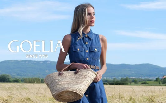 a lady in a denim dress with a belt