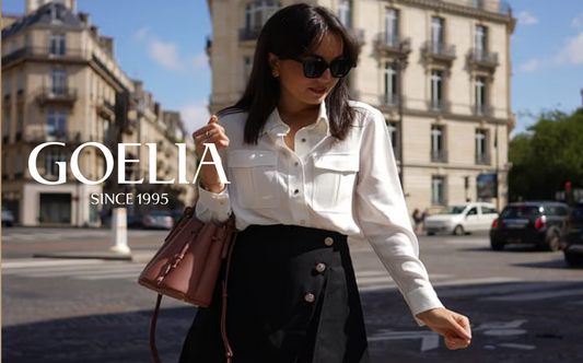 A beautiful woman wears a white shirt and a skirt