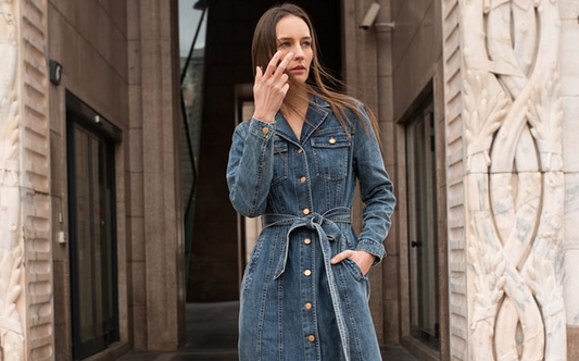 a lady in a single-breasted denim dress with a belt