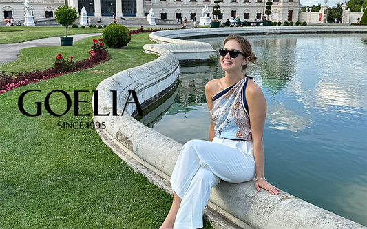 A lady with sunglasses wears cotton pants in Italy in summer.