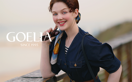 A lady wears a silk scarf and a denim jacket.