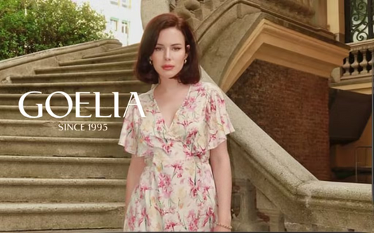 a lady in a pink floral printed dress