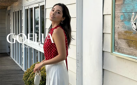 a lady wears a polka dots printed halter top with white pants 