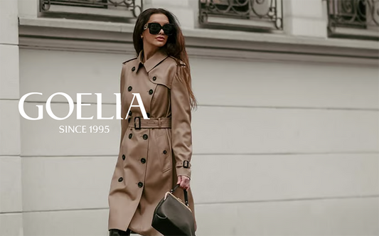 a lady in a camel trench coat 