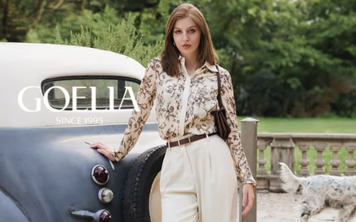 a lady in a floral printed shirt and a pair of white pants