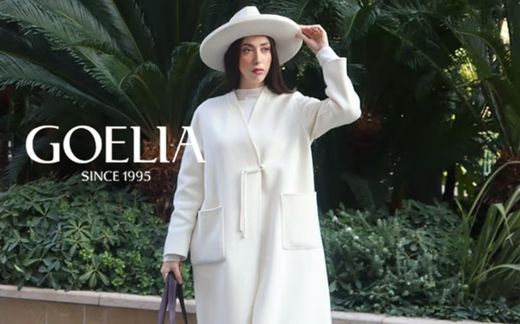 a lady in a white wool coat