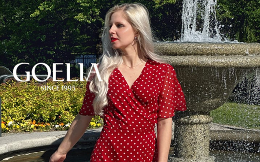 a lady in a red v-neck dress with white polka dots