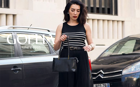 a lady wears a striped tank top with black wide leg pants 