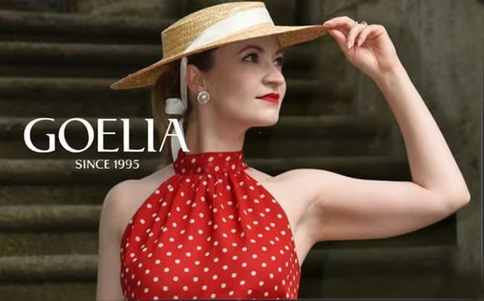 a lady in a red off the shoulder top with white polka dots